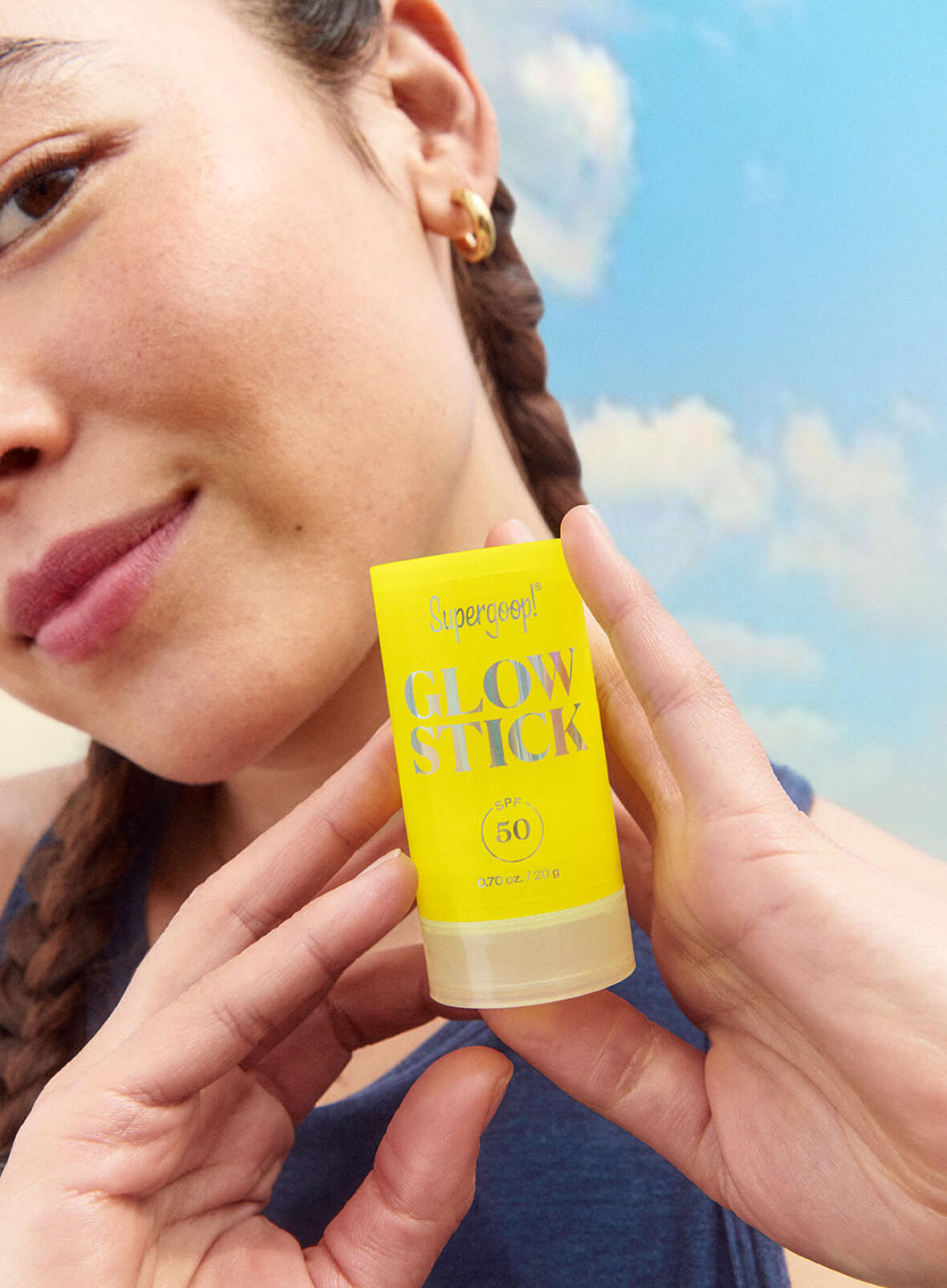 Supergoop! Glow Stick SPF 50 0.70 oz. 2-pack model holding