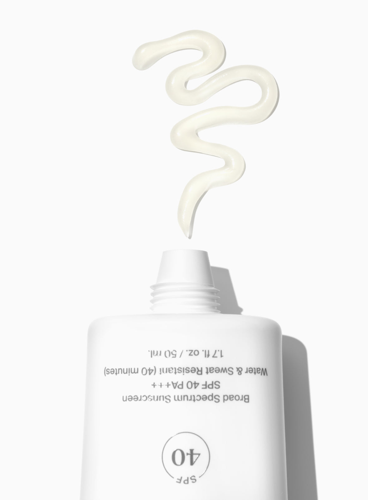 Supergoop! Unseen Sunscreen SPF 40 packshot with textures