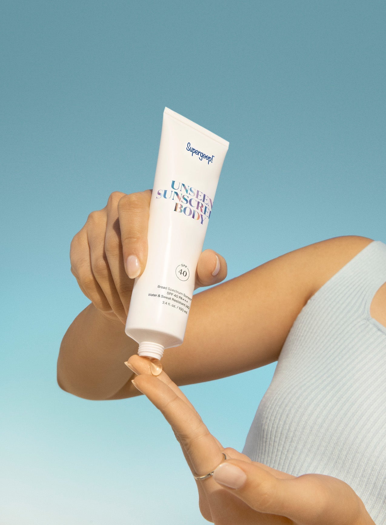 Supergoop! Unseen Sunscreen SPF 40 and Unseen Sunscreen Body SPF 40 applying on model